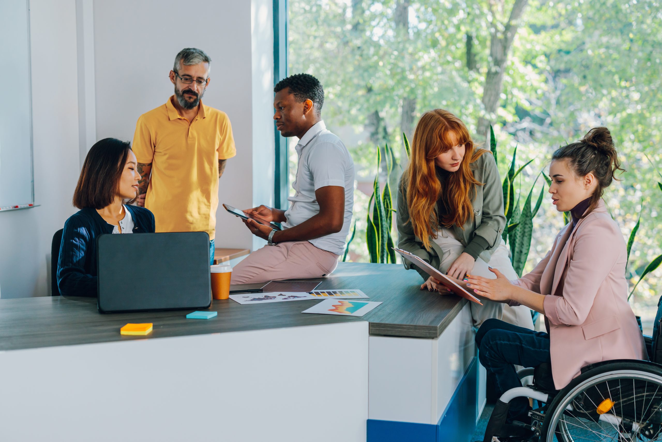 Diverse team having meeting at boardroom.